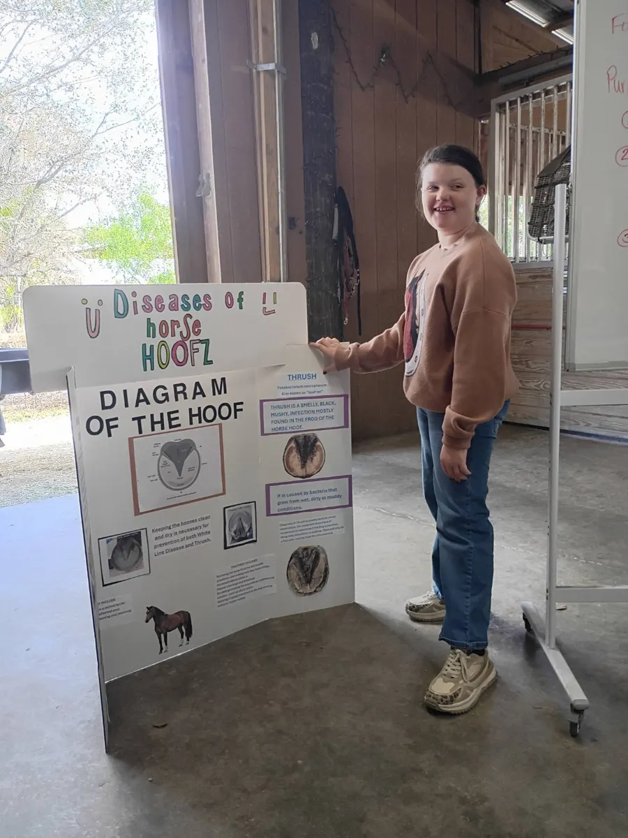 A student learning about hoof care